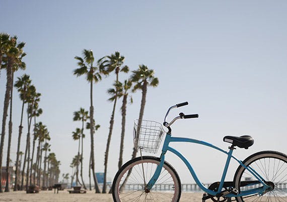 blue-bicycle-cruiser-bike-sea-ocean-beach-california-coast-usa-cycle-near-lifeguard-tower